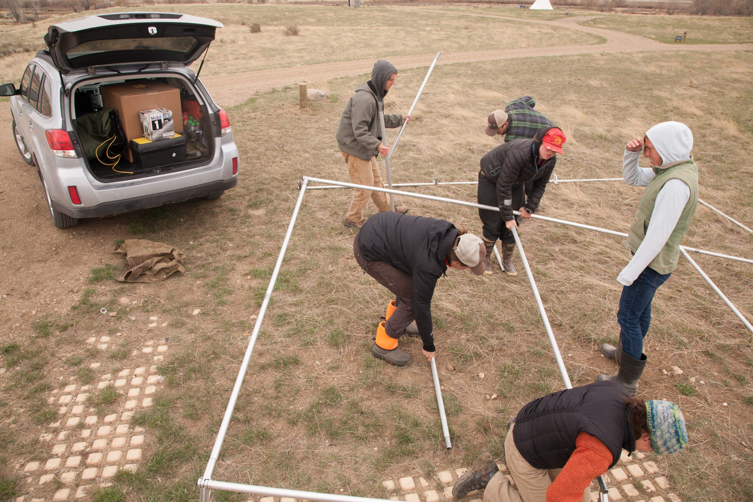 Assembling the outfitter's tent frame on a cold day